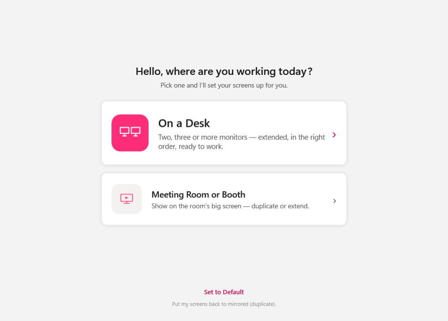 The ScreenSwytch app — the Home screen where you choose On a Desk or Meeting Room and it arranges your monitors